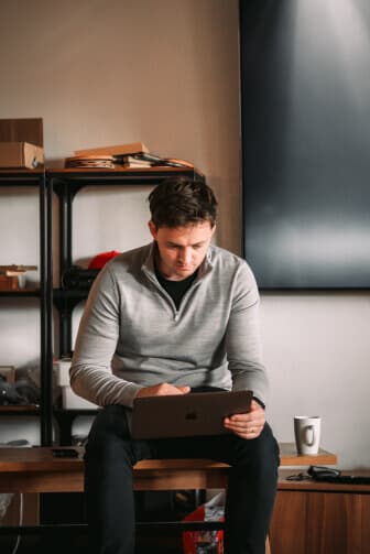 Andrew pretending to look busy on a laptop